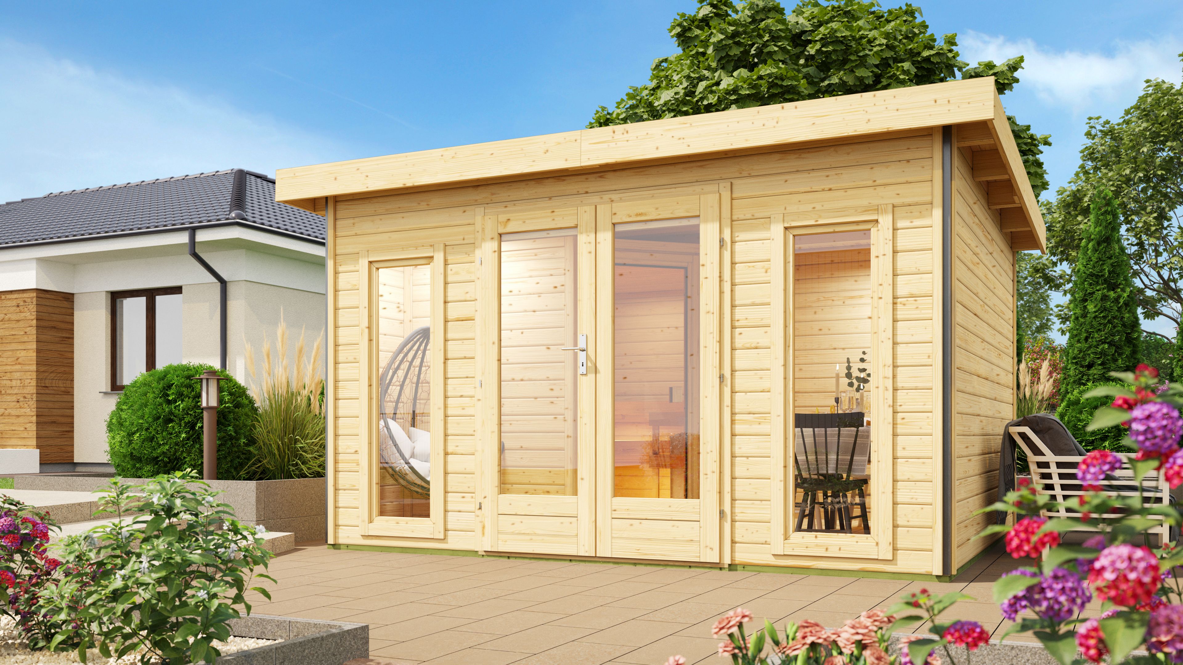Karibu Saunahaus Mainburg 2 als Gartensauna aus Massivholz im Garten mit Glasfront