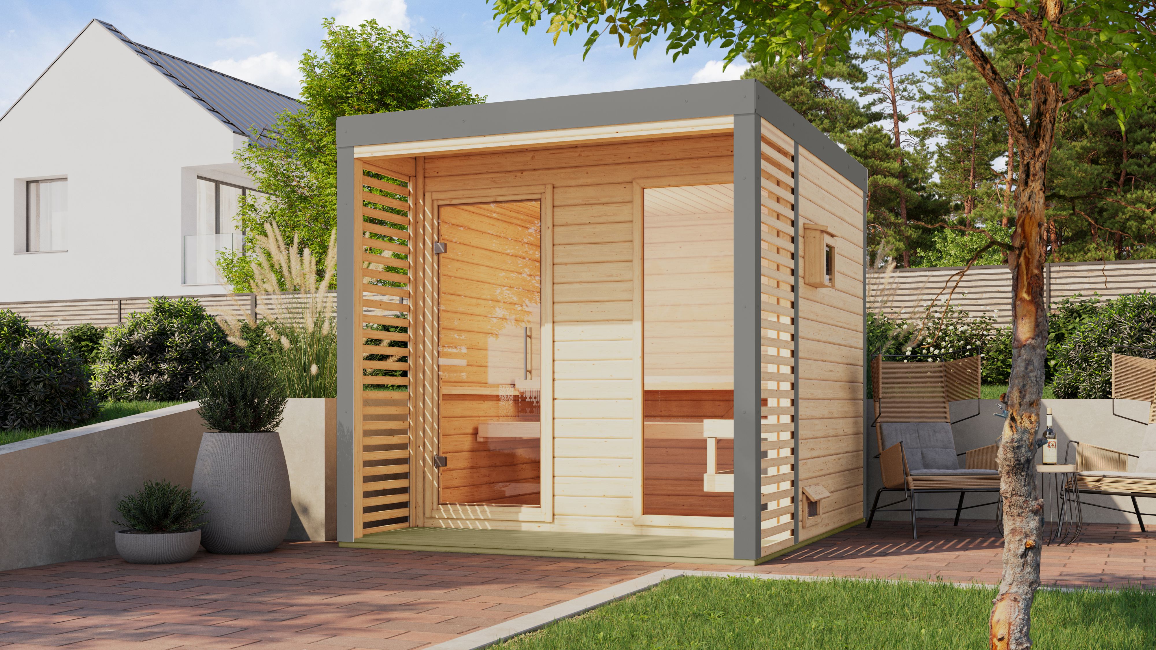 Karibu Saunahaus Ares 2 als Gartensauna aus Massivholz im Garten mit Glasfront