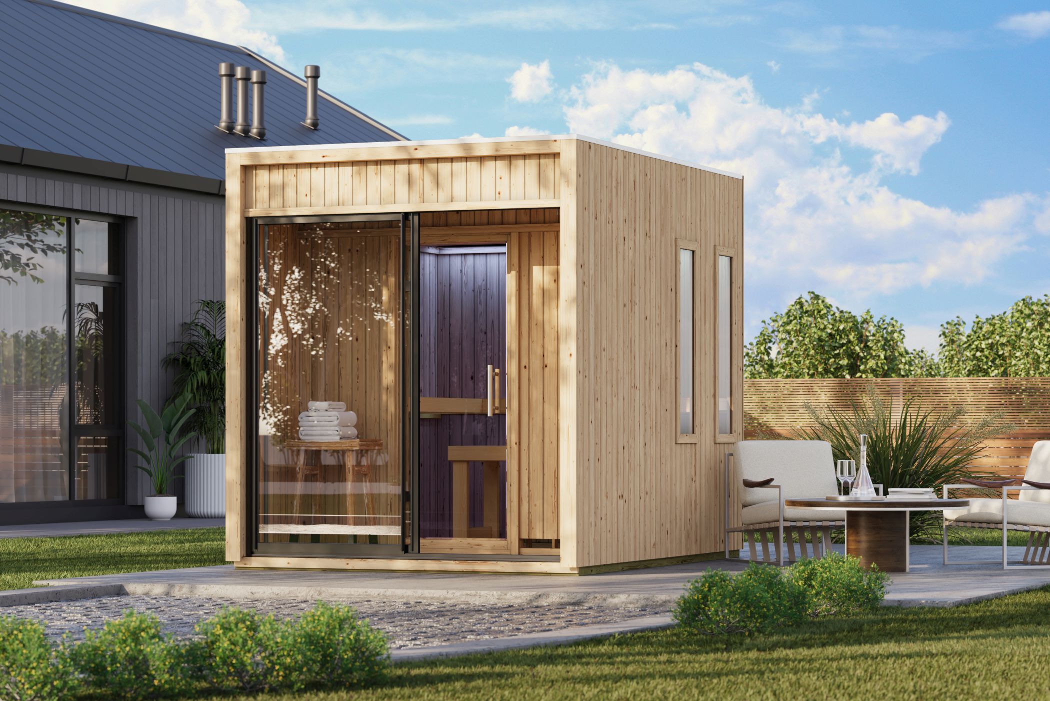 Karibu Saunahaus Delano als Gartensauna aus Massivholz im Garten mit Glasfront