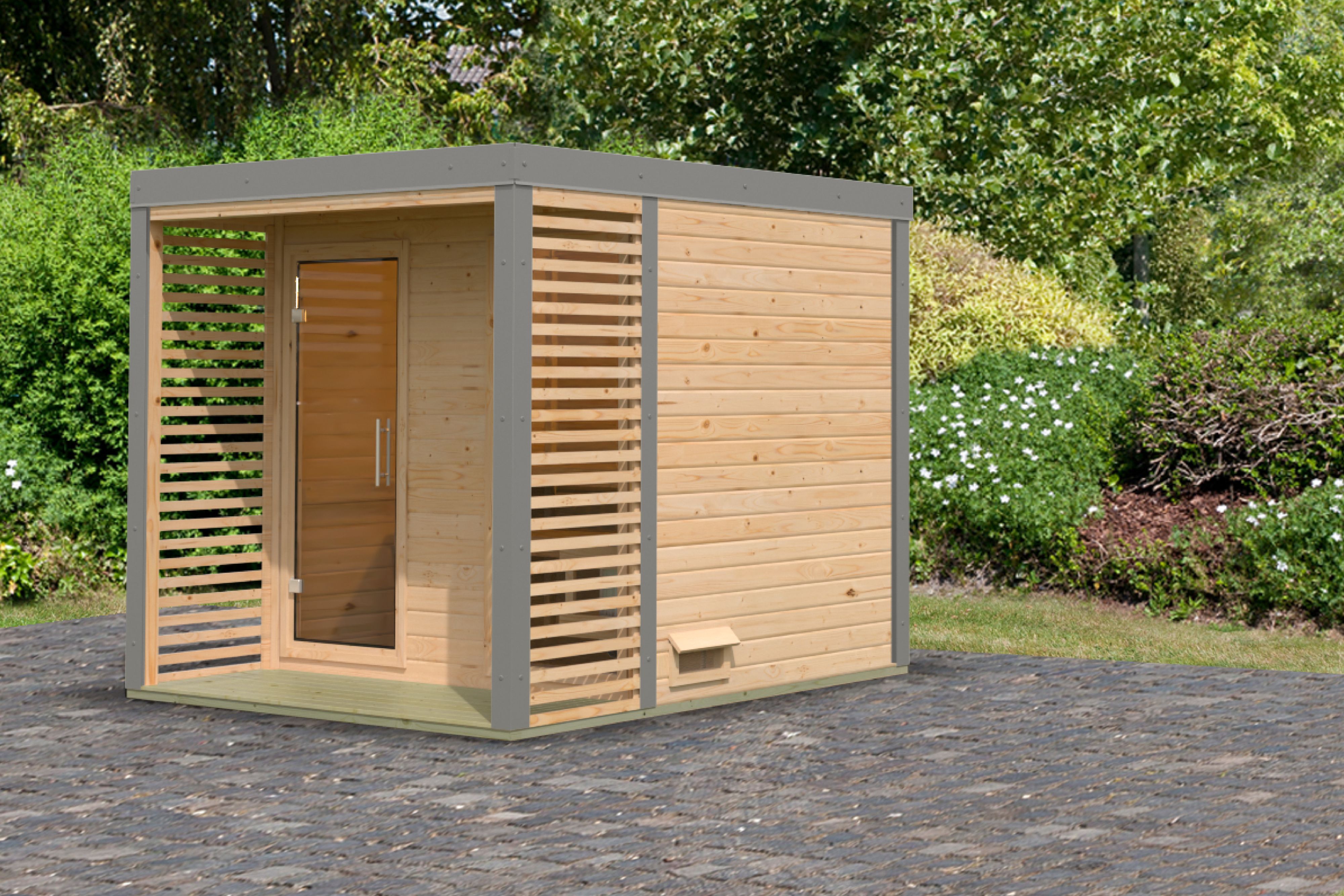 Karibu Saunahaus Ares 2 als Gartensauna aus Massivholz im Garten mit Glasfront