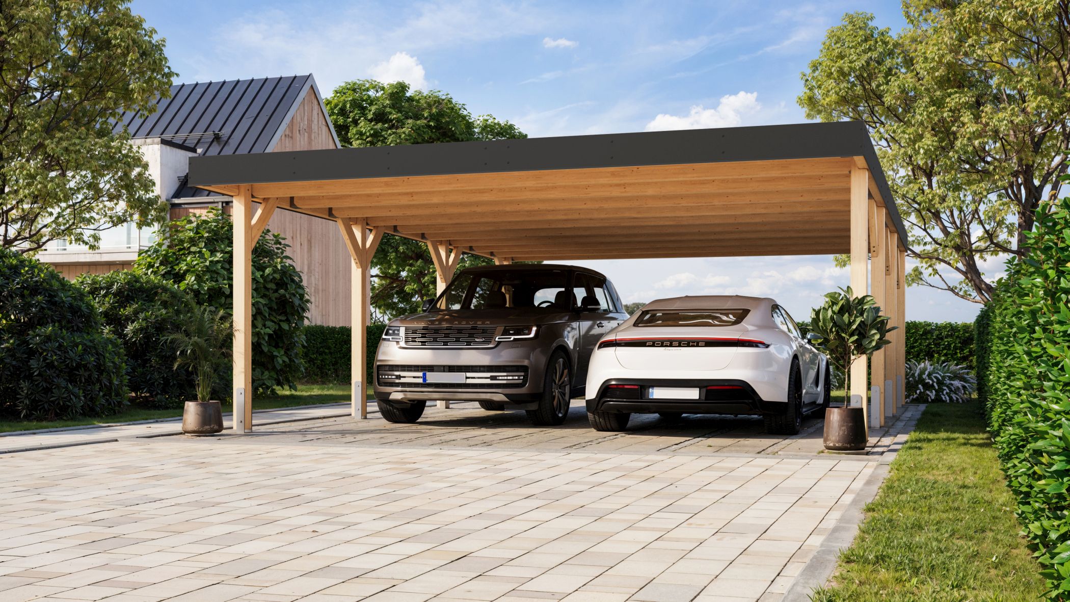Karibu Doppelcarport Leimholz 2 aus Leimholz mit Flachdach im Garten aufgebaut