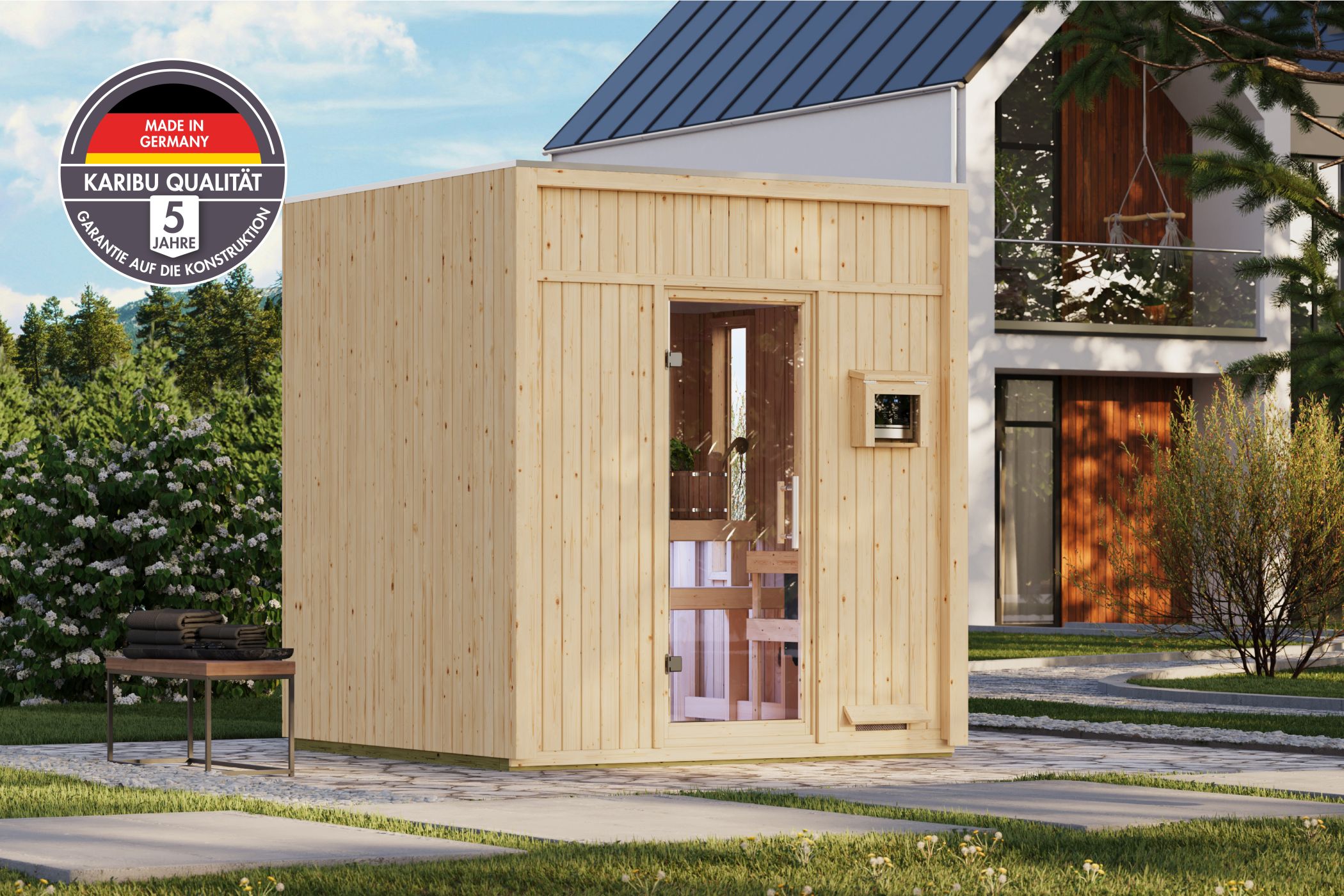 Karibu Saunahaus Avenal als Gartensauna aus Massivholz im Garten mit Glasfront