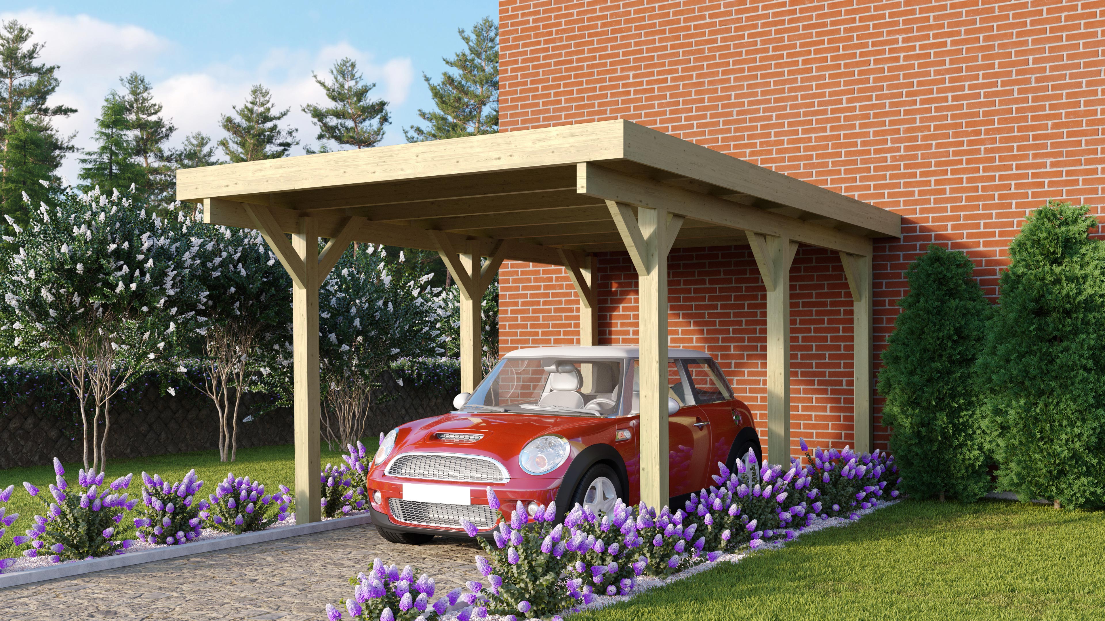 Karibu Einzelcarport Classic 1 aus KDI-Massivholz im Garten aufgebaut als stimmungsvolle Ambiente-Ansicht